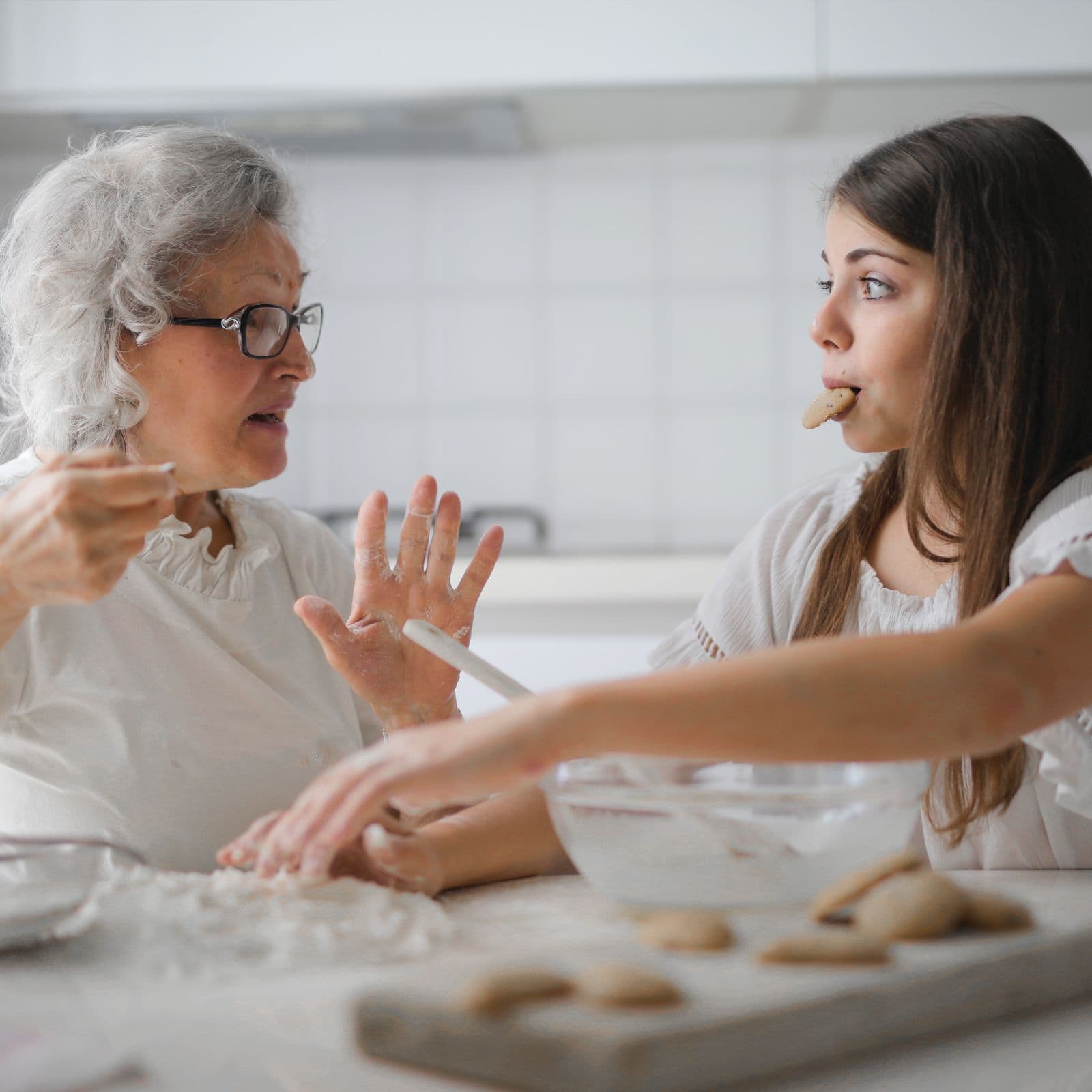 A mother and daughter in kitchen.